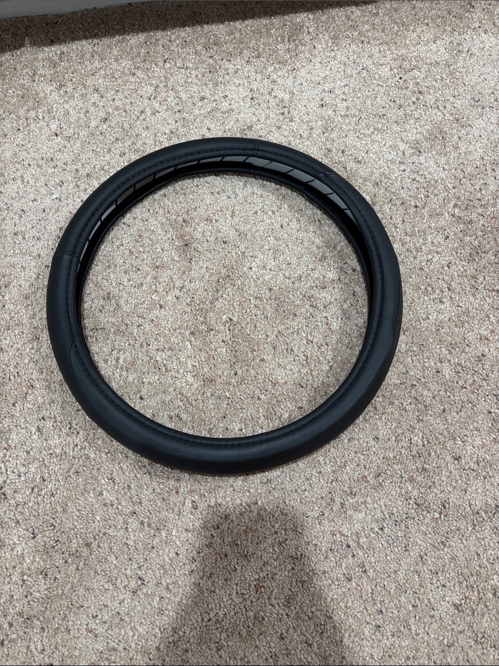 Steerong wheel cover in black in faux leather